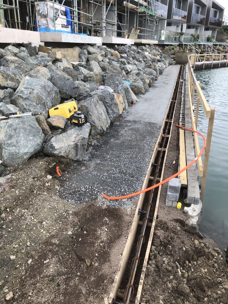 Waterfront rock feature installation in Gulf Harbour